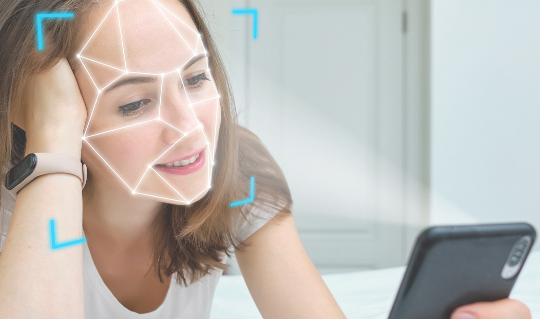 Woman looking at her smartphone with futuristic lines tracing her face.