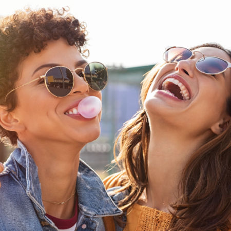 Two women flirting and laughing with each other