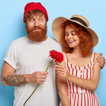 Nervous man giving new love interest Valentine's Day flowers