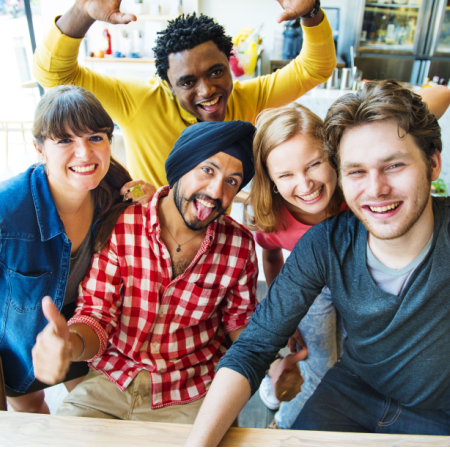 Single woman smiling with group of other single friends