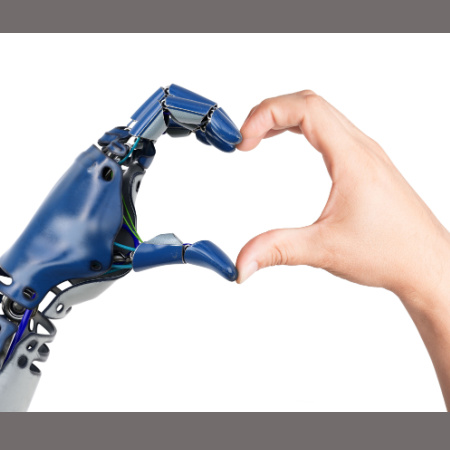 Robot hand and human hand joined in a heart shape
